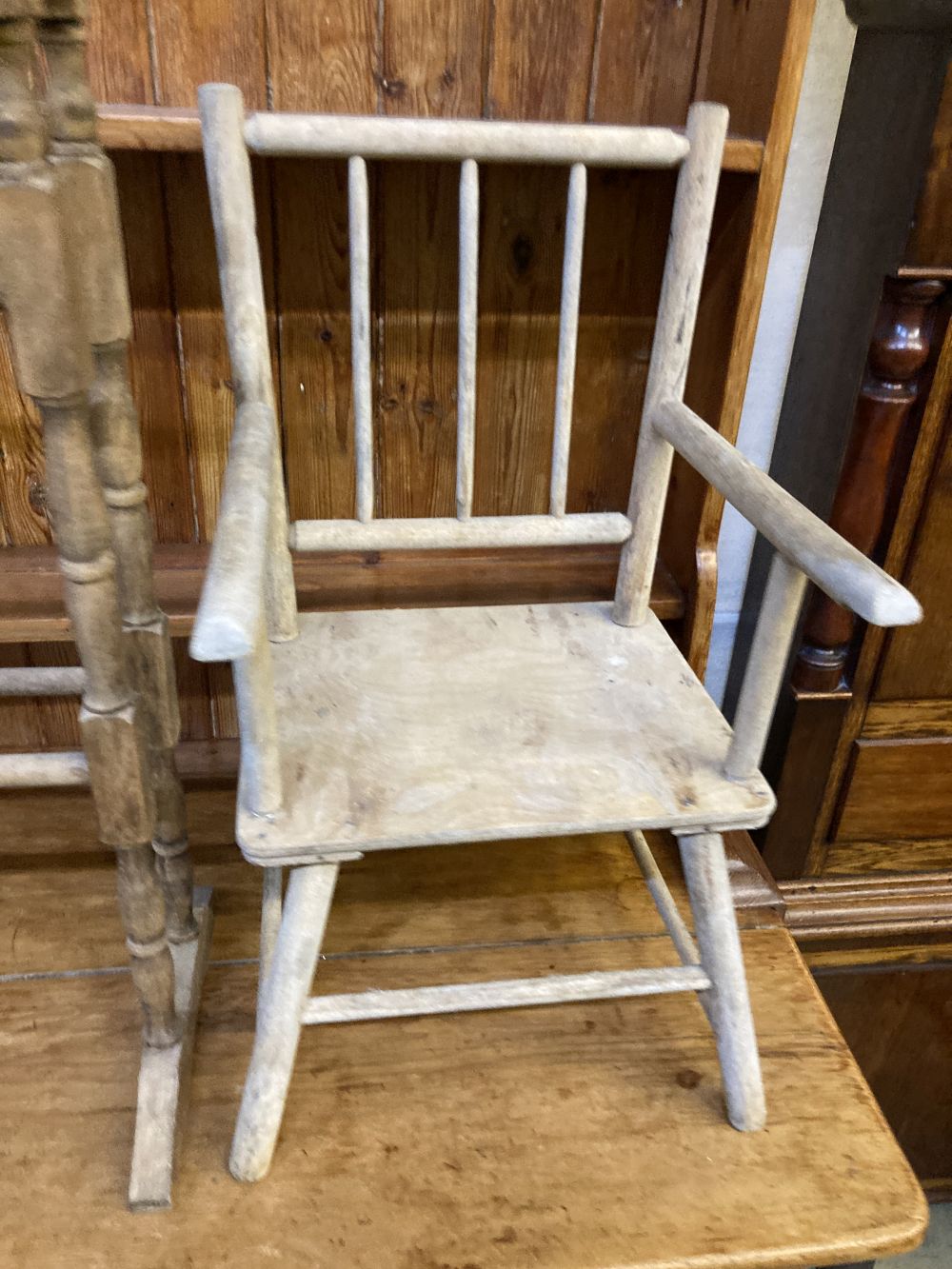 A Victorian towel rail, a primitive childs elbow chair and a metamorphic chair
